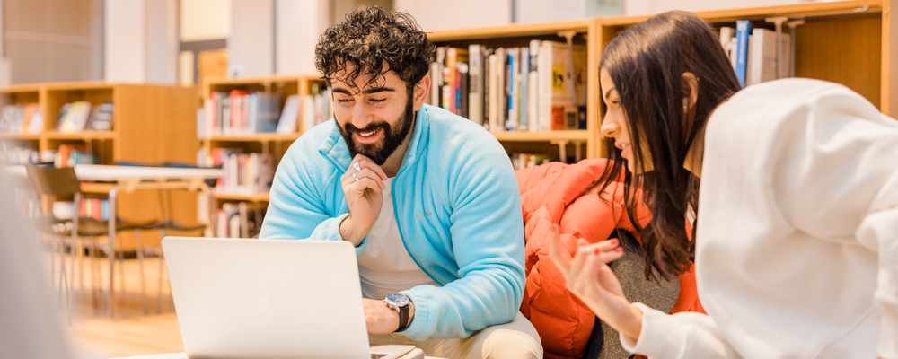 Student sitting with a laptop